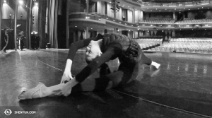 Dancer Jessica Si stretches before a performance at the Living Arts Centre in Mississauga, Canada. (photo by projectionist Annie Li)
