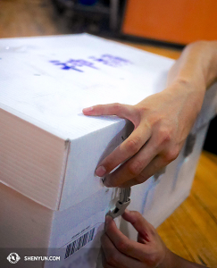 The last buckle… on the last prop box.  (photo by dancer Ben Chen)