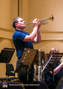 Principal trumpeter Eric Robins warms up before the performance at Taiwan’s Chiayi City Cultural Center Music Hall.
