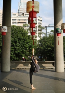 A final shot of Angelia Wang performing the “gold standard crown.” Considered one of the most challenging techniques for female dancers, it requires incredible flexibility, core strength, and balance. (Photo by Kexin Li)