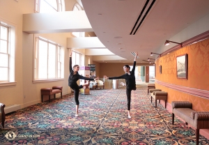 Dancers Cherie Zhou (left) and Diana Teng warm up before a performance at The Hippodrome Theatre in Baltimore. (Photo by dancer Helen Li)