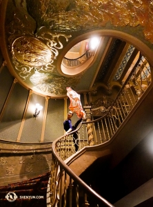 Principal Dancer Chelsea Cai poses with a Shen Yun Shop scarf amidst the Spanish Baroque motifs at the Orpheum in Phoenix. (Photo by Annie Li)