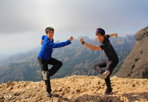 Even the day after two performances in Barcelona, many in the group hiked all the way up. At the top, dancers Jeff Chuang (left) and Rui Suzuki still had energy to monkey around. (Photo by Songtao Feng)