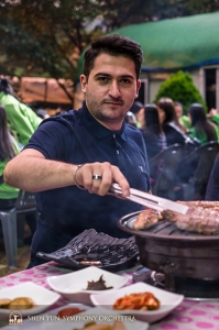 From there, the orchestra traveled to the city of Daegu, where the first concert would take place. Principal violinist Stepan Khalatyan and the rest of the group had a traditional Korean barbecue to get in the mood.  (Photo by TK Kuo)