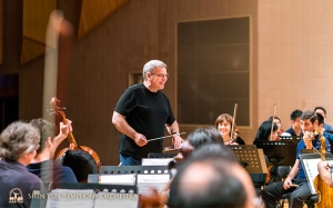 The conductor sharing a chuckle with his team.