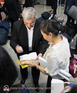 Conductor Milen Nachev is spotted, and stops to sign the first of many autographs.