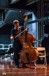 Bassist Wei Liu prepares for rehearsal.