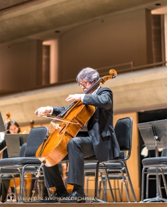 Cellist Alexander Dardykin grabs a precious opportunity to practice on stage.