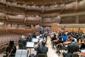 Conductor Milen Nachev leads rehearsal at Roy Thomson Hall.