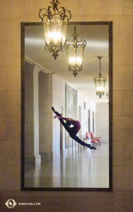 Is that a picture of a Shen Yun dancer on the wall at the San Francisco War Memorial Opera House? Actually, it's a reflection of Principal Dancer Elsie Shi, making her way through the lobby! (Photo taken by principal dancer Kexin Li)