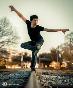 Originally from Tokyo, Japan, Principal Dancer Kenji Kobayashi balances on train tracks in Denver, Colorado. The Shen Yun New York Company performed at the Buell Theatre Feb. 9–11. (Photo by dancer Tony Zhao)