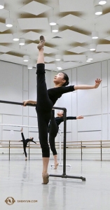 Dancer Cecilia Wang holds her leg at 180 degrees in the open space of the practice room. (Photo by Rachael Bastick) 