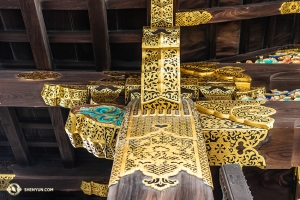 The bright colored and intricate detailing on the interior support beams in the castle. (Photo by Andrew Fung)
