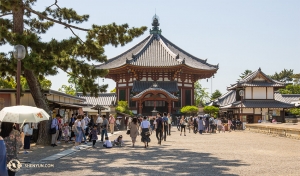 In contrast to the busy city streets, we also see buildings showcasing some of the more traditional architectural styles of Japan. (Photo by Andrew Fung)