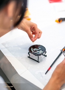 The dexterous fingers of our pipa player are perfect for the delicate work.