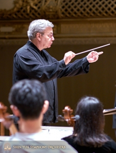 Conductor Milen Nachev fine-tuning a piece.