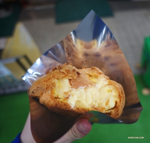 Dancer Shawn Ren bites into a sweet vanilla cream puff from a local store. (Photo by Shawn Ren)