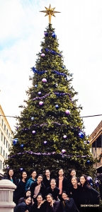 In the United States, Shen Yun World Company poses together in front of a giant Christmas tree in New Orleans, LA.