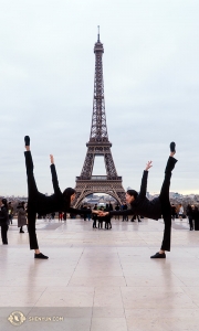We're so excited to be in Paris! Flanking the 130-year-old Eiffel Tower are dancers Olivia Zhang (left) and Elsie Shi. (Photo by percussionist Tiffany Yu)