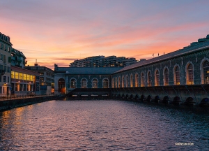An illuminated B&acirc;timent des Forces Motrice at dusk. (Photo by Andrew Fung)