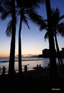 Local surfers on the beach in Honolulu&mdash;a typical Hawaiian postcard scene. (Photo by Jeff Chuang)