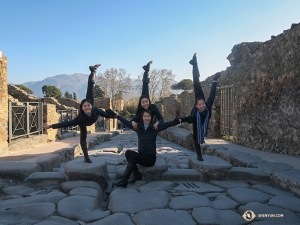 Sophie Xie offers her fellow dancers (from left) Xindi Cai, Ceci Wang, and Jenni Song support while they balance on the city that was well preserved by the ash from the eruption of Mount Vesuvius in 79 A.D. 

(Photo by dancer Diana Teng)