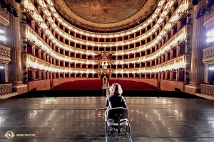 Erhu soloist Qi Xiaochun prepares for sound-check during setup at the Teatro di San Carlo in Naples, Italy. (Photo by Rachael Bastick)
