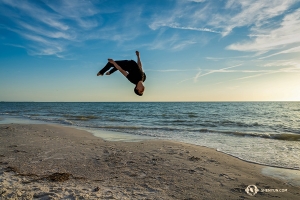 There isn't much time left before the sun goes down. Dancers hurriedly take to the air, just for the fun of it. (Photo by Tony Xue)