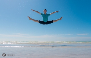 The sandy beach doesn't hold back the dancers from getting good height.
