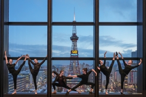 With less than two hours until showtime, these dancers strike their final pose, signaling the start of their warm-up routine and preparations for the performance.